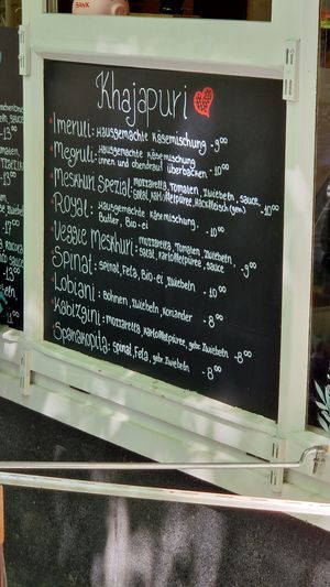 ask staff which items can be veganized by omitting the cheese at Royal Healthy Slices in Munich