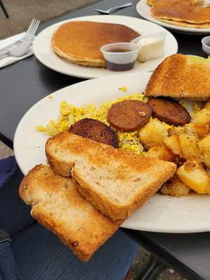 The hungry vegan - pancakes, tofu scramble, sausage, potatoes, toast at Donut Villa Diner in Malden