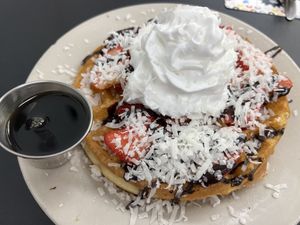 Chocolate and Strawberry waffle with coconut whipped cream 😍  at Donut Villa Diner in Malden