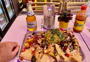 Fully Loaded Nachos - my hands are big!!!  at Club Mexicana - Soho in London