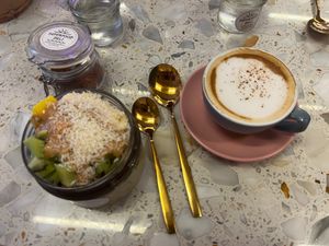 Granola bowl and cappuccino at Superfood Deli - Maria Theresien in Vienna