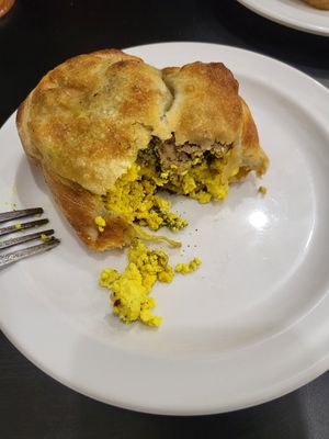 Tofu scramble and vegan sausage inside the breakfast calzone at Community Grounds in Columbus