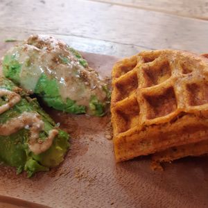 Sweet potato waffle with avo, tahini, cumin. at The Plant Bar Vegan Cafe in Barnstaple