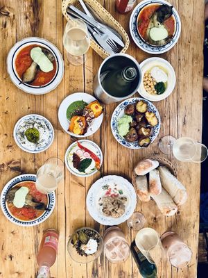 Hot aubergine, cauliflower, Petnat wine, caramelized sweet potato, Hummus, Labneh, Tahini and Spicy, fresh and warm bread, torn potatoes, Majadara,   at Cafe Pilz in Berlin