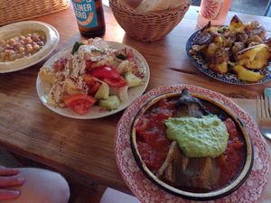 Hummus, brotsalat, hot aubergine and potatoes at Cafe Pilz in Berlin