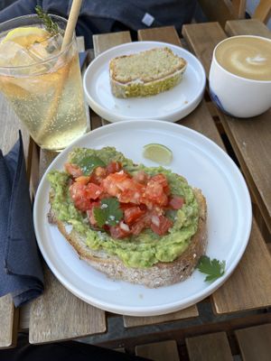 Delicious vegan options: avocado toast, pistachio lemon cake, thyme limonade and cappuccino with oat milk  at Twenty Twenty Coffee in Hvide Sande