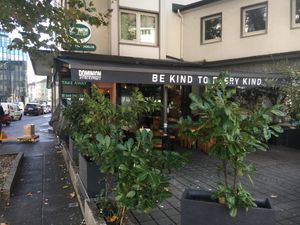 SIde entrance, plus outdoor seating. at Dominion Food Revolution in Frankfurt