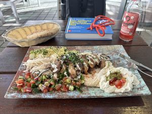 Mushroom shawarma with hummus, taboule, israeli salad and labane  at Dominion Food Revolution in Frankfurt
