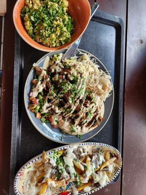Tabouleh salad, Dominion mix plate, oyster mushroom loaded fries at Dominion Food Revolution in Frankfurt