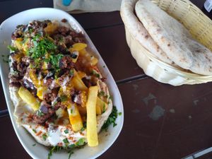 Loaded fries with minced meat and hummus at Dominion Food Revolution in Frankfurt