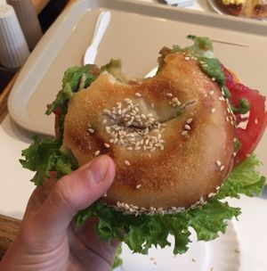 sesame seed bagel and avocado, lettuce, and tomato at Bodo's Bagels in Charlottesville