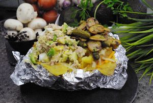 Una patata grande asada con toppings encima a tu gusto  at Patata Lab in Denia