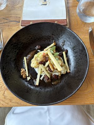 Cauliflower with walnuts, raisins, apple and walnut miso  at Restavracija Sunrose 7 in Bohinjska Bistrica