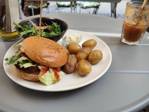 Cheese burger with potatoes, salad and mayo and an apple juice at Seed in Luxembourg City