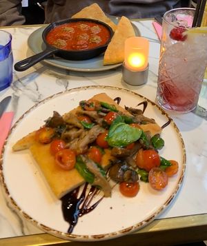 Starters of plant balls in sauce and a flatbread with veg  at Lucia in York