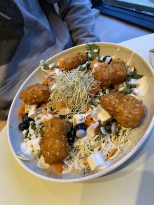 Salad with blueberries, topped with Naturli’s nuggets and garlic dressing  at Naturli' in Oslo