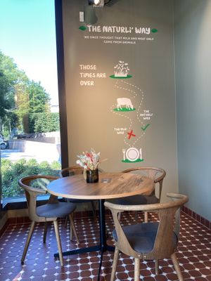 Table with pro-vegan wall decotation at Naturli' in Oslo