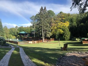 Pool and volleyball field at Sivananda Ashram Yoga Camp in Val-morin
