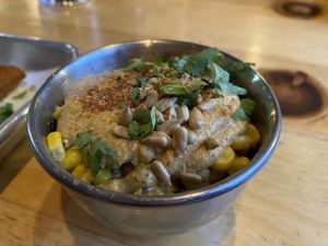 Elote - corn in cup with cashew cream, sunflower seeds, cilantro, tajin   at Switchback in Durango