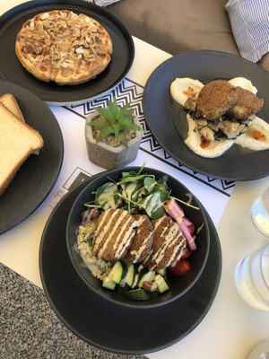Vegan toast, waffle falafel bowl, and mushrooms on houmous  at Fotis All Day Bar in Naoussa