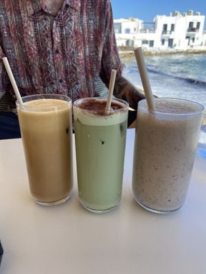 Iced latte, iced matcha latte and smoothie with pb, banana, dates, vegan protein powder and almond milk   at Fotis All Day Bar in Naoussa