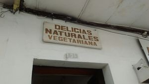 Outdoor sign at Delicias Naturales in Popayan