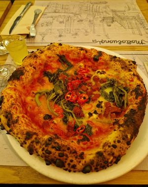 Tomato base pizza with vegan cheese, chilli, vegan ventricina and friarielli. at Molto Buono in Bristol