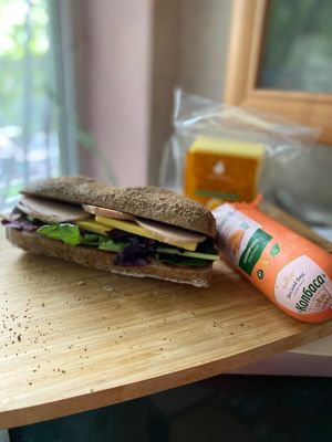 Made a sandwich 🥪 with sausage with vegan smoked cheese at Green Bean in Almaty