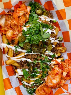 Vegan K Fries - fries, vegan meat in bulgogi sauce, jalapeno, kimchi, cilantro, spring onion, vegan mayo. at The Cool Cat in Warsaw