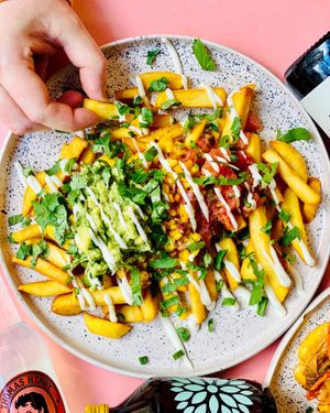 Mex Fries - fries, salsa pico de gallo, mango salsa, guacamole, vegan mayo, cilantro, spring onion (gf). at The Cool Cat in Warsaw