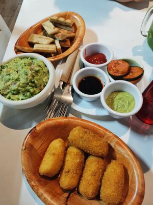 Fresh bread sticks mozzarella stick home made pickle and sauces and guacamole at NA NA  in Playa Del Carmen