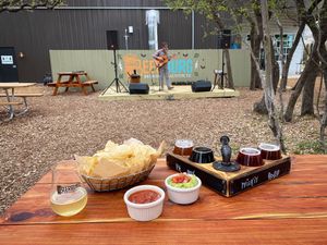 Chips and guac, a flight of beer and some Friday evening music! at Beerburg Brewing in Austin
