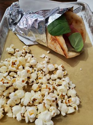 Chickpea wrap (minus feta) with side of popcorn at Grazery in Carlisle
