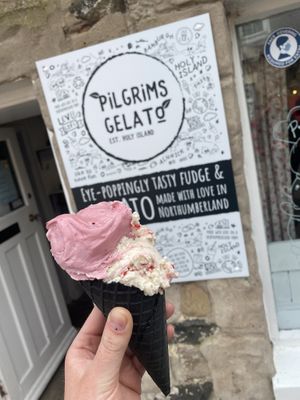 Berry smoothie and raspberry ripped ice cream in cone.  at Pilgrims Fudge Kitchen and Gelateria in Lindisfarne
