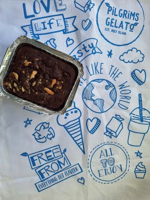 Family brownie, and tea towel at Pilgrims Fudge Kitchen and Gelateria in Lindisfarne