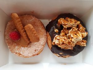 Sugar-coated with Lotus filling, chocolate with peanut butter & jam filling at Royal Donuts  in Mannheim