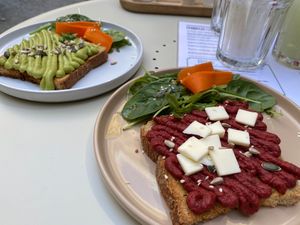 Toast with beetroot hummus and vegan cheese; toast with avocado paste at Maria Limão in Porto