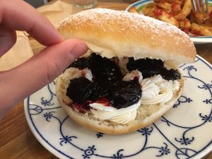 Sweet donut burger with black cherry jelly and cream at Hatena in Tokyo