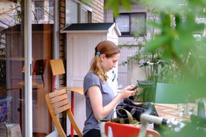 Nice outdoor seating! (me on my phone lol) at Hatena in Tokyo