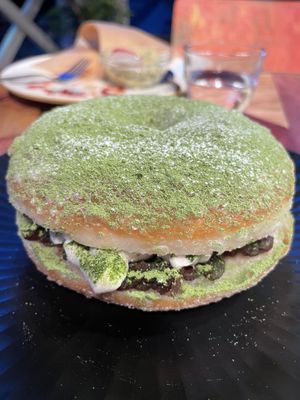 Stuffed matcha donut filled with adzuki beans and vegan cream. at Hatena in Tokyo