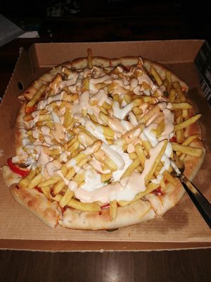 Got an inferno and added their gorgeous sauces and chips!  at Vizza Guys in Gateshead