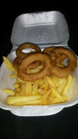 Shared side of chips and onion rings  at Vizza Guys in Gateshead