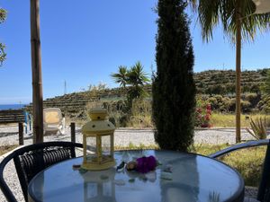 Outside the yurtas   at Darjas Yurtas in Benajarafe