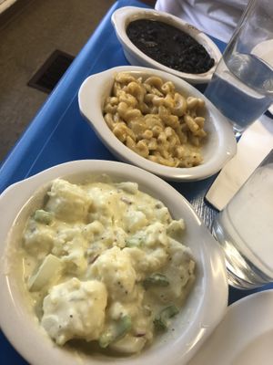 Sriracha beans, Mac and chee and potato salad!! at Earth Based Cafe in Martinsburg