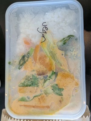 Vegan curry in plastic takeaway container at Crooked Kitchen in Bendigo