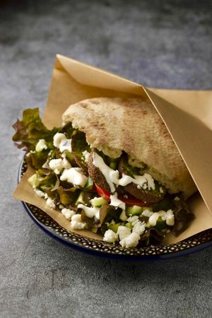 Edamame falafel pita sandwich with beetroot hummus, tomato, cucumber, black tahini, soy yogurt & feta cheese. 
(can be made vegan) at Salam in Tokyo