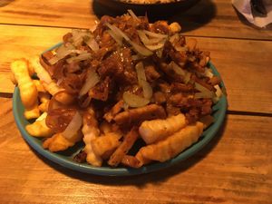 Loaded poutine
(Fries, cheese, mushroom gravy, seitan, bacon and carnalized onions) at Plant Base in Lisbon