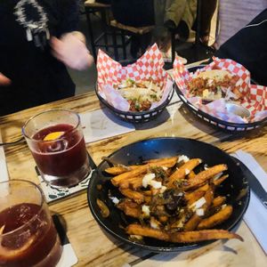 Beetroot cocktail, loaded poutine and tacos  at Plant Base in Lisbon