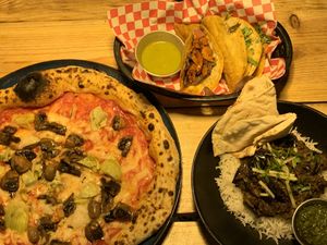 Pizza, tacos y tikka masala  at Plant Base in Lisbon