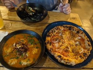 Momo and pizza at Plant Base in Lisbon